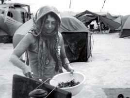 MAPS volunteer Sandra Karpetas prepares a meal at Burning Man